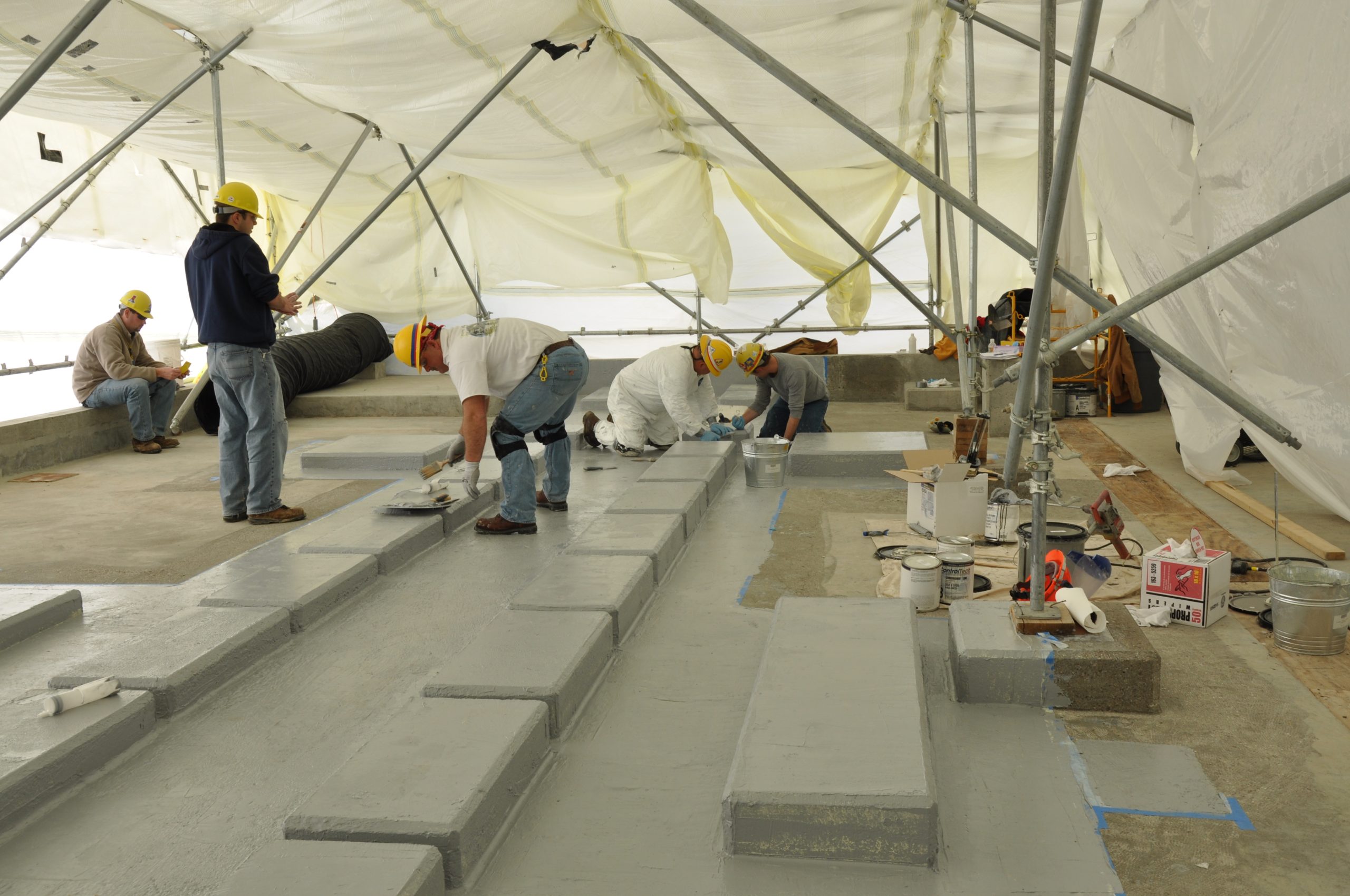 Diamond grinding an old commercial slab to profile before coating in McKinney, TX