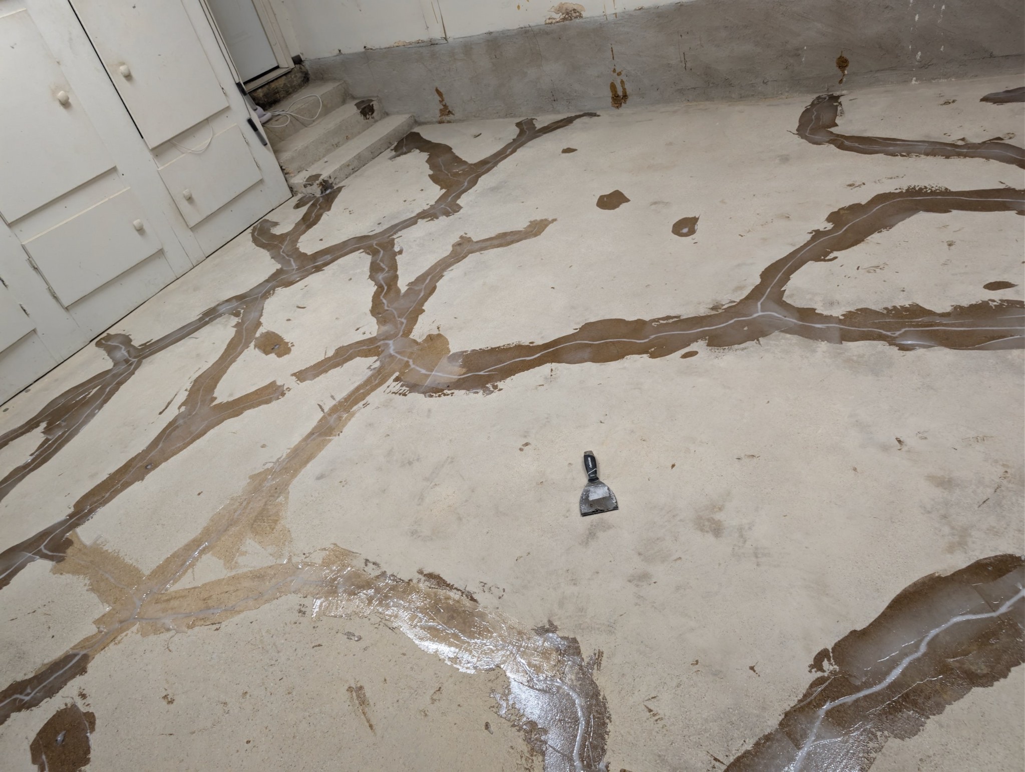 Concrete slab crack chased open and filled during floor preparation