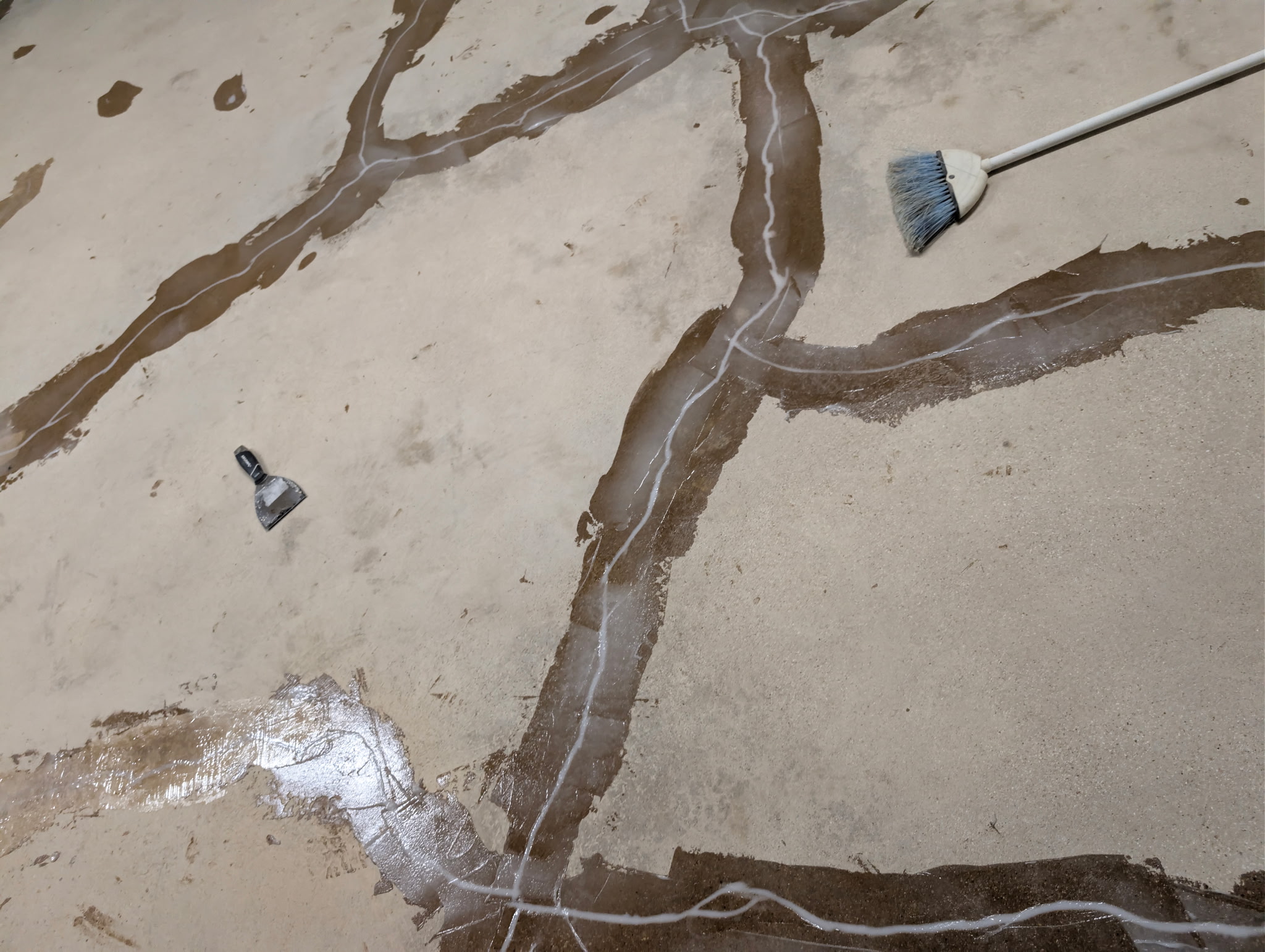 Routed garage floor cracks filled with structural repair epoxy in Dallas-Fort Worth, TX
