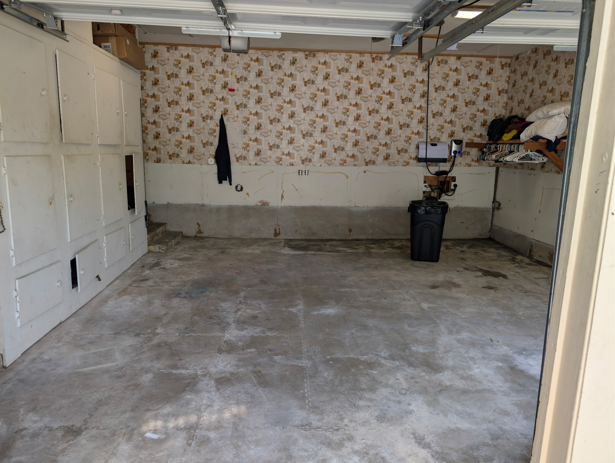 Bare new-construction garage slab awaiting a coating in McKinney, TX